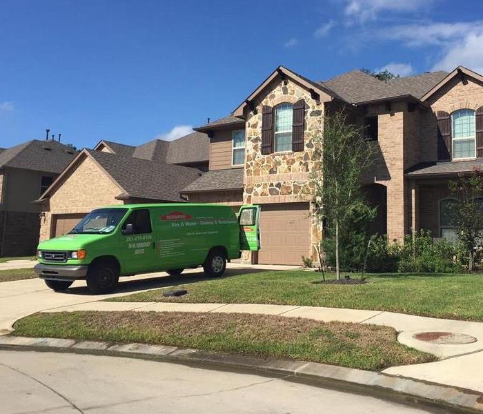 SERVPRO truck sitting outside of a home.